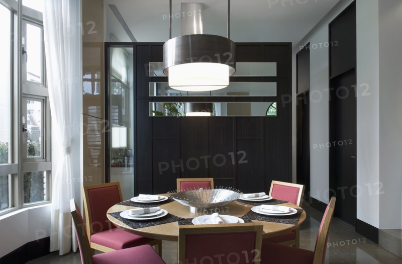 Circular dining table with place settings