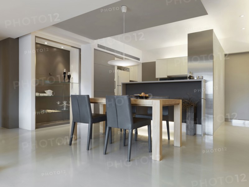 Dining room table outside small modern kitchen