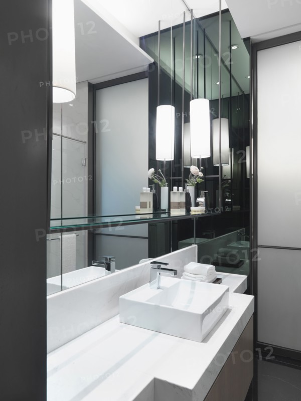 White bathroom sink on white countertop