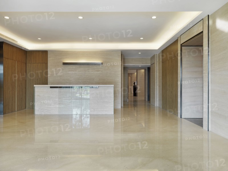 Reception desk in light-colored minimalism lobby