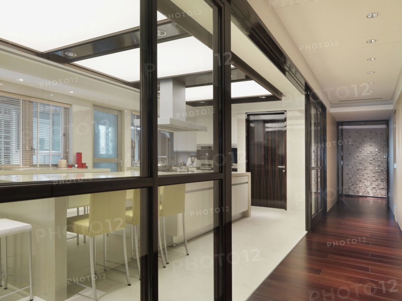 Hardwood hallway along kitchen with pocket glass doors