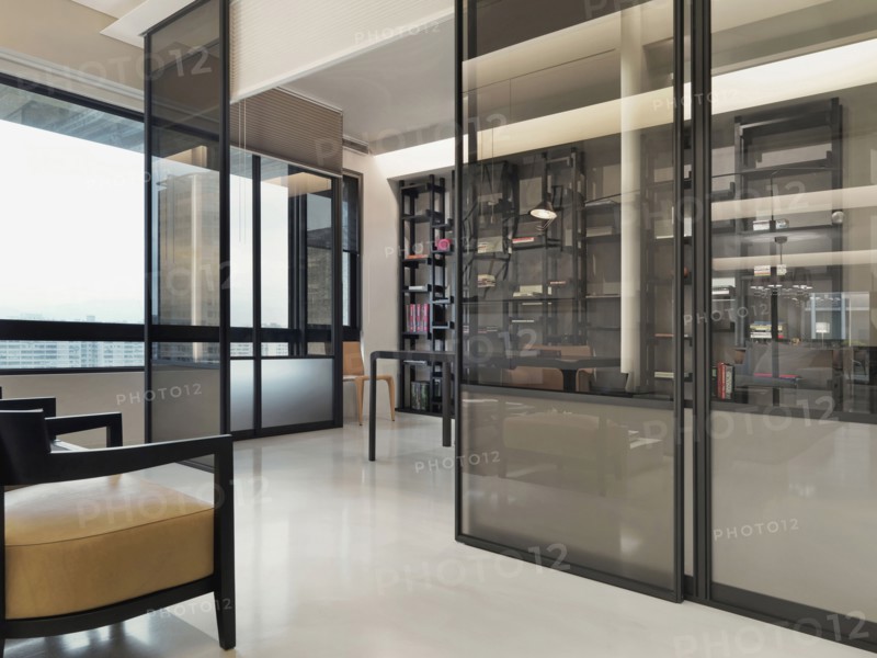 Pocket doors separating living from office in modern home