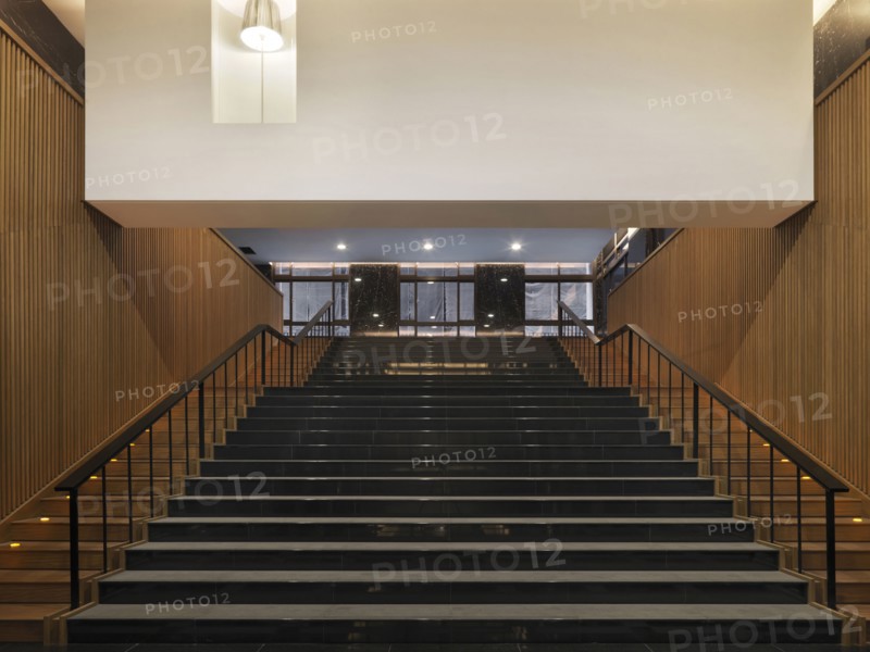 Large black tile and wood staircase