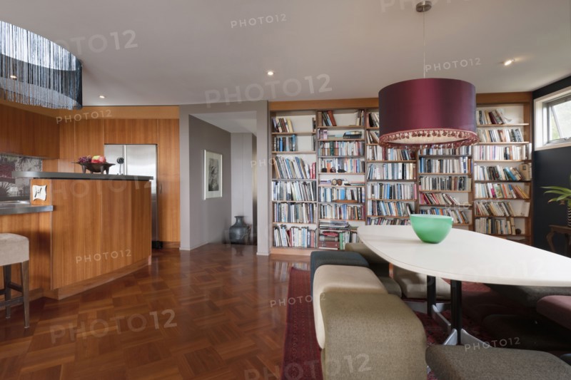 Dining area and library in contemporary house
