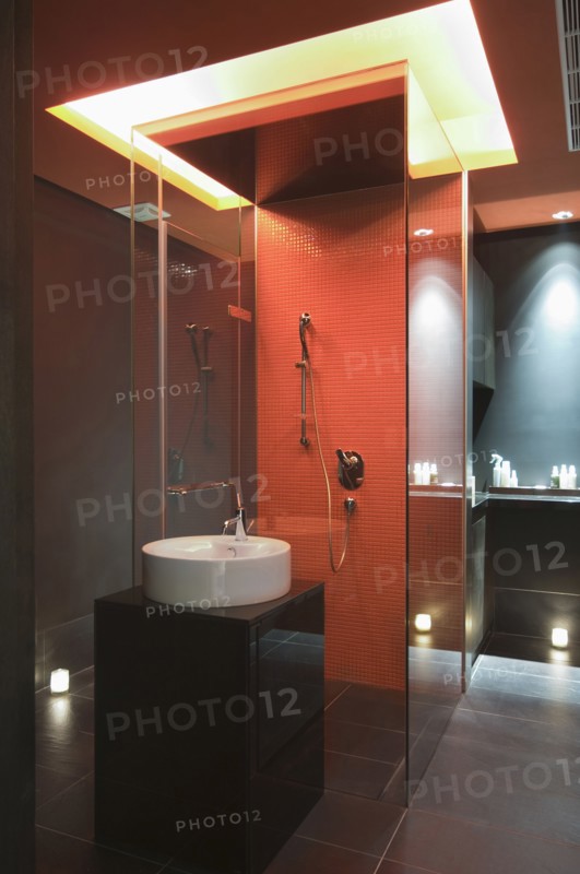 Interior of lit modern bathroom at spa