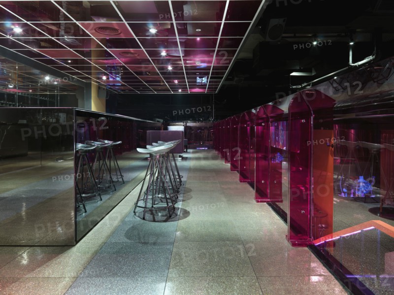 Bar counter and stools in modern nightclub