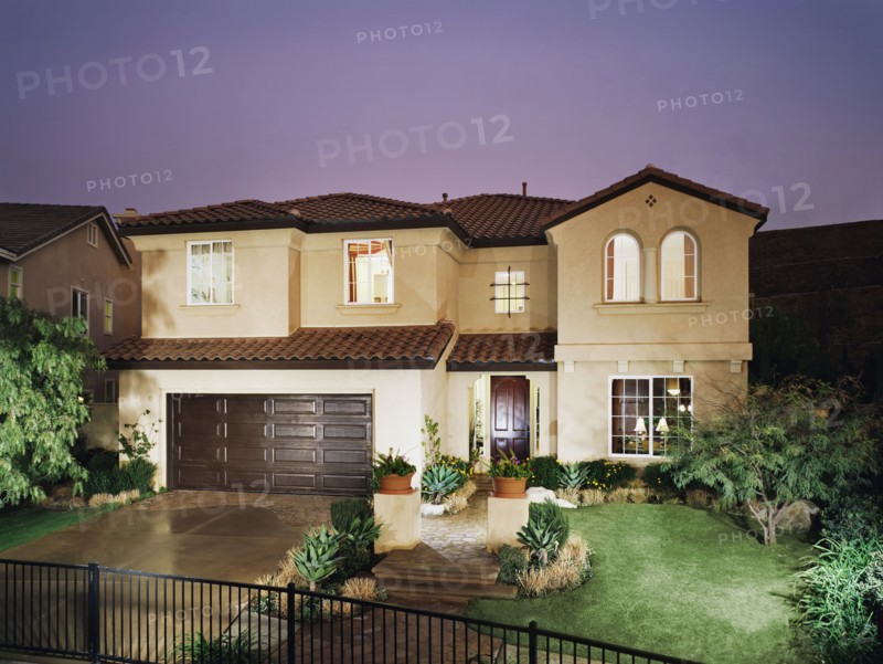 Front exterior multiple story spanish style home