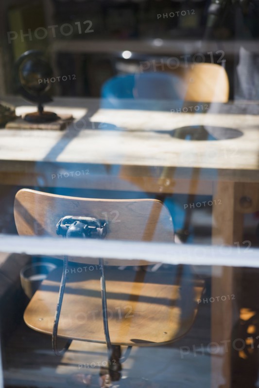 View through window old fashion desk chairs at table