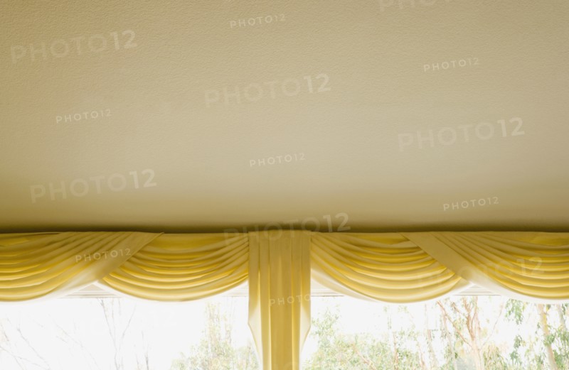 Yellow Valance and Curtains on Window