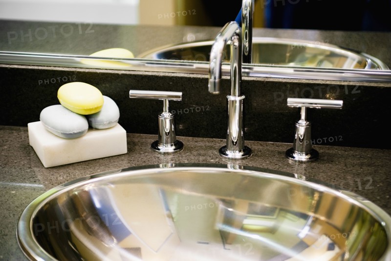 Detail of Metal Bathroom Sink and Faucet