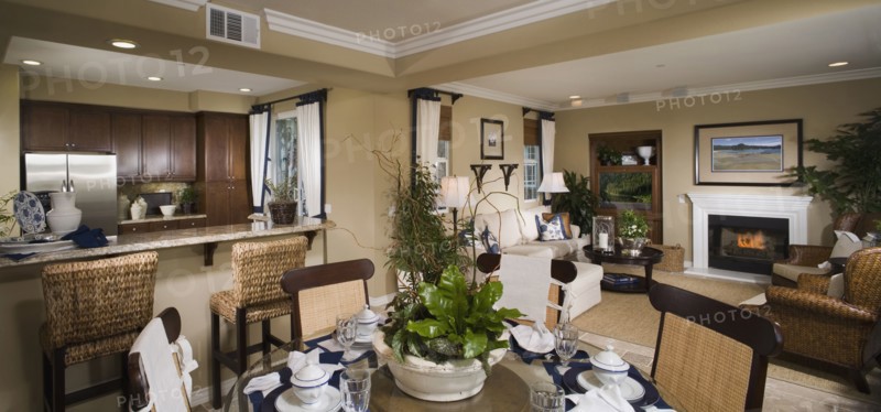 Contemporary view of kitchen living and dining areas of home