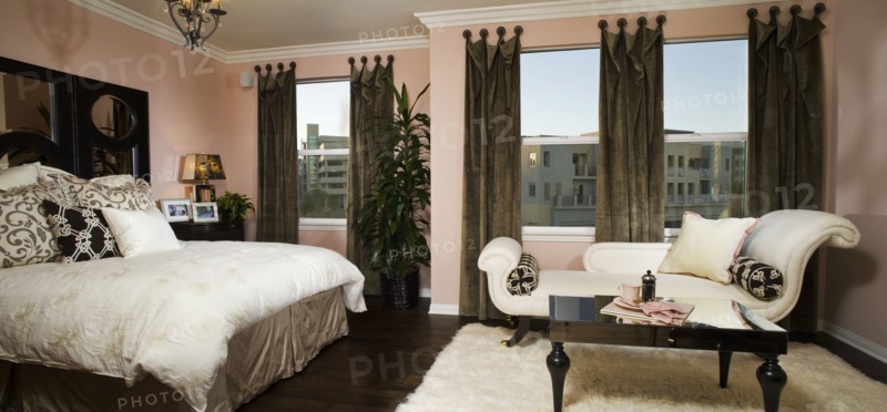 Elegant master bedroom with chaise lounge