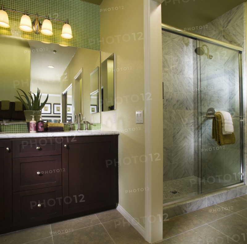 Warm Bathroom with Shower with green accents