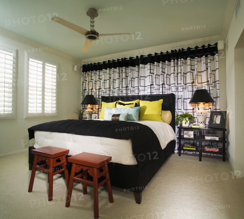 Brightly Colored Bedroom with Red Stools