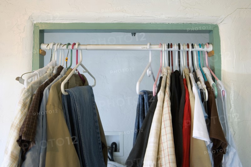 Curtain Rod in Doorway with Hanging Clothes