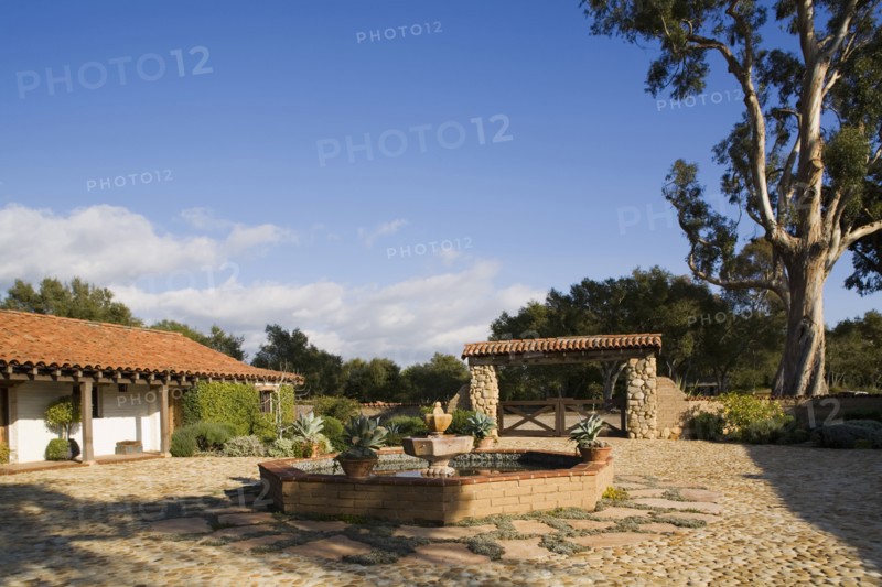 Exterior of Spanish Style Home and Landscape