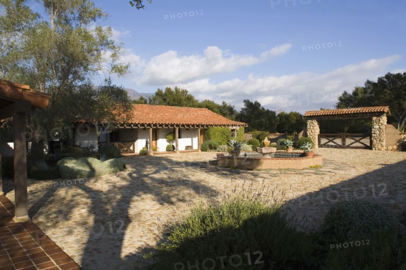 Exterior of Spanish Style Home and Landscape