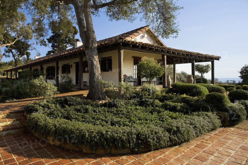 Exterior of Spanish Style Home and Landscape