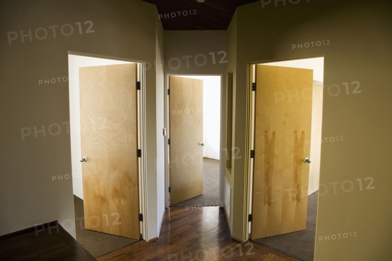 Three Open Doors in Modern Hallway