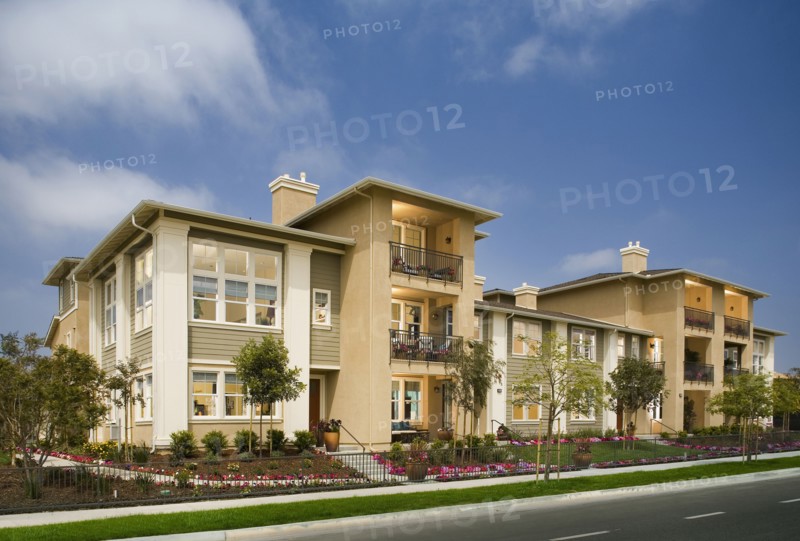 Exterior of attached homes on a sunny day