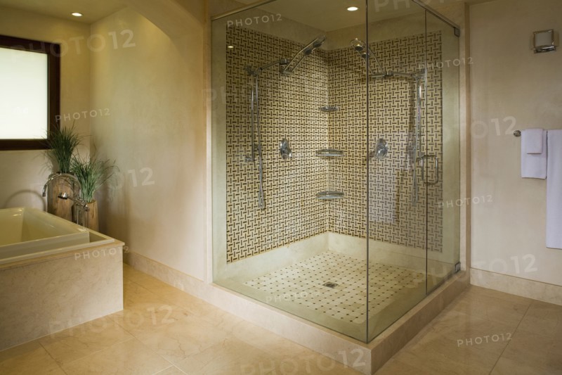 Modern seamless glass shower with double shower heads