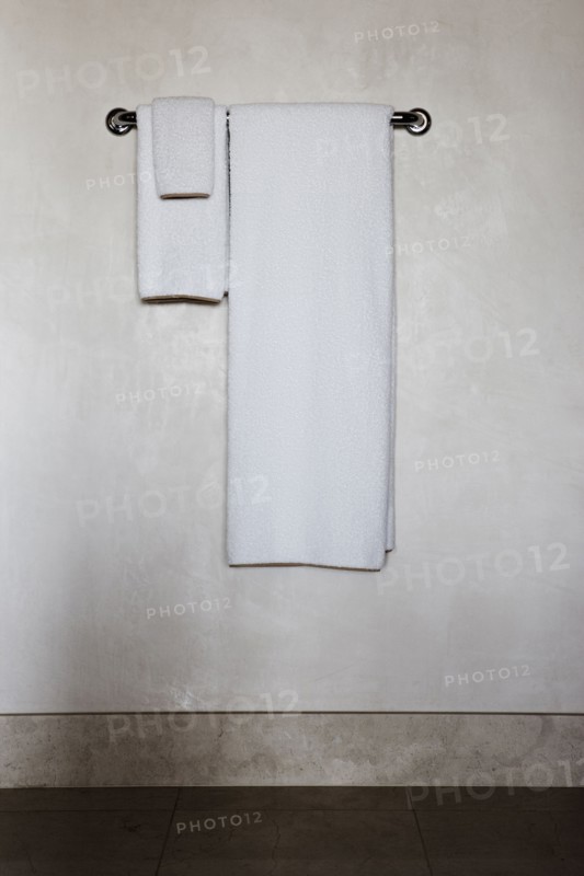 Detail of white towels on a towel rack
