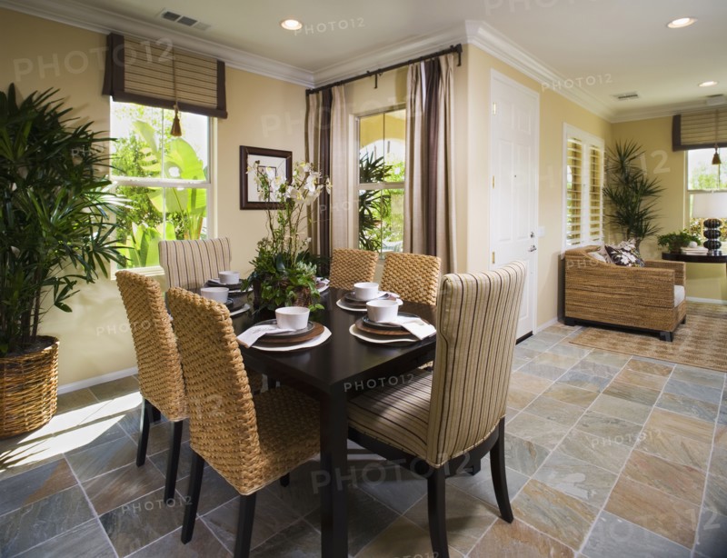 Dining room with tile floor and recessed lighting