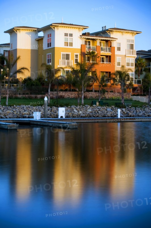 Exterior of residential building with reflection in lake