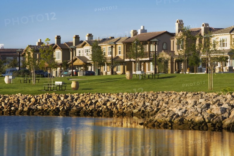 View of contemporary housing community from across channel