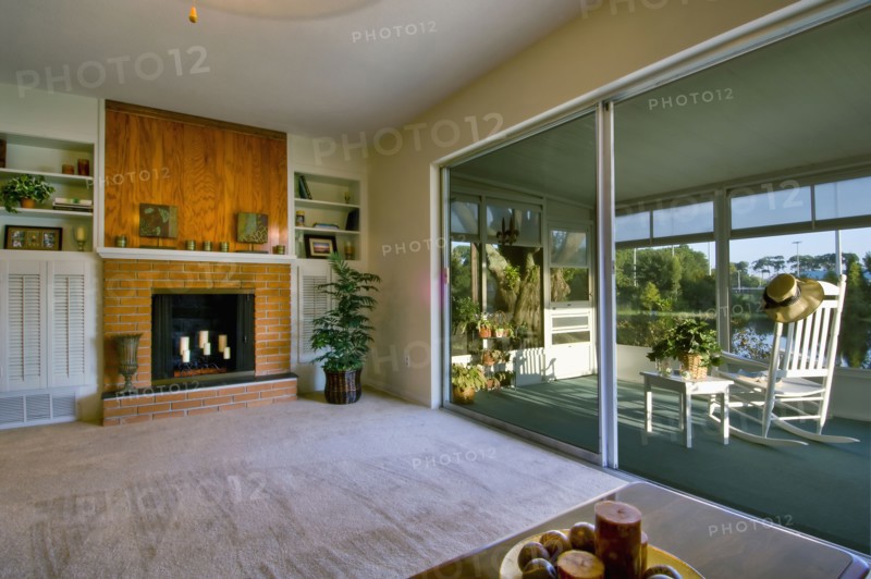 Living room and sunroom in traditional home