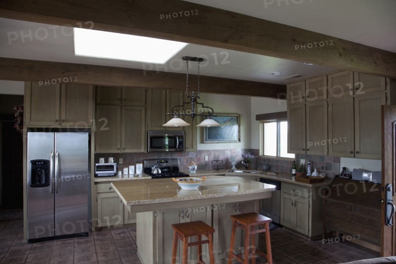 Western style kitchen with breakfast bar and island