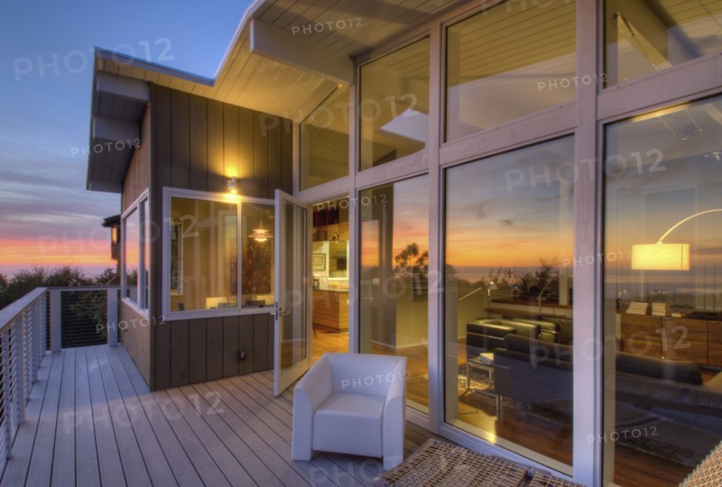 Balcony with glass doors in contemporary house
