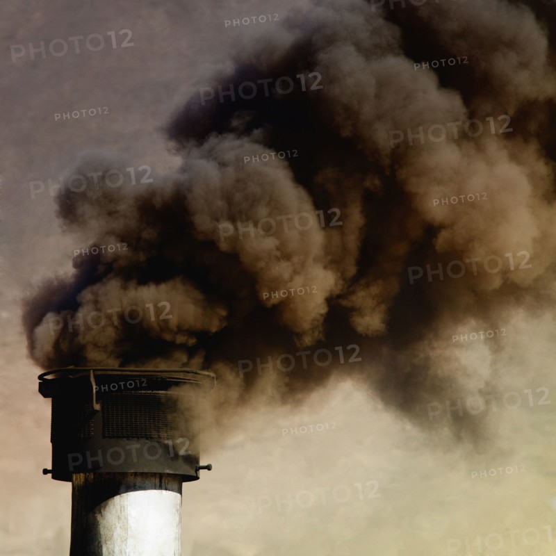 Close up of smoke billowing from smoke stack