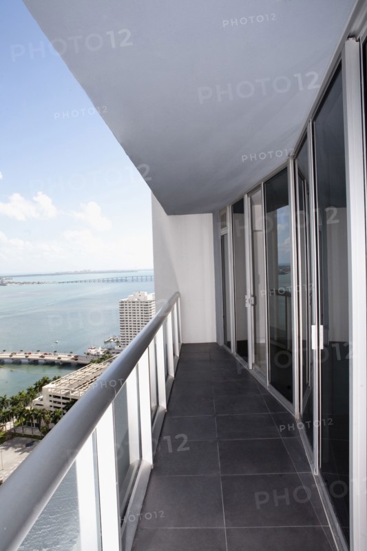 Balcony of modern apartment overlooking waterfront