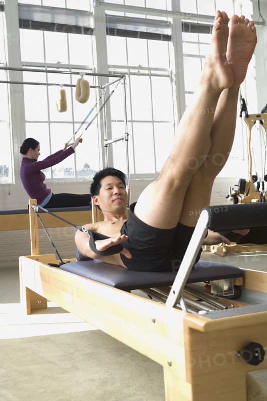 People stretching in exercise studio
