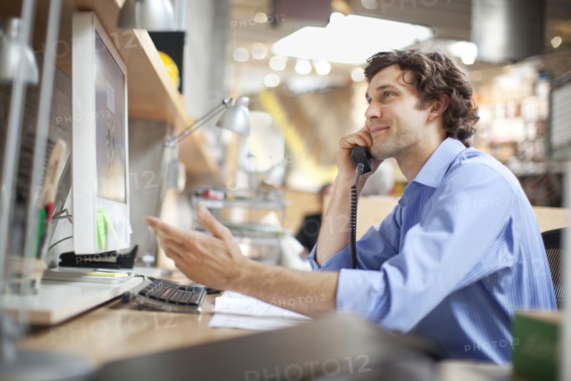 Hispanic businessman talking on telephone