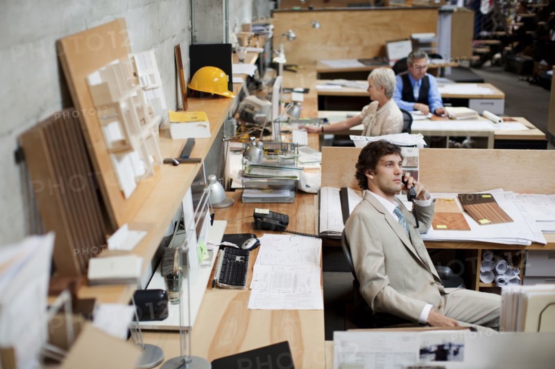 Business people working in busy office