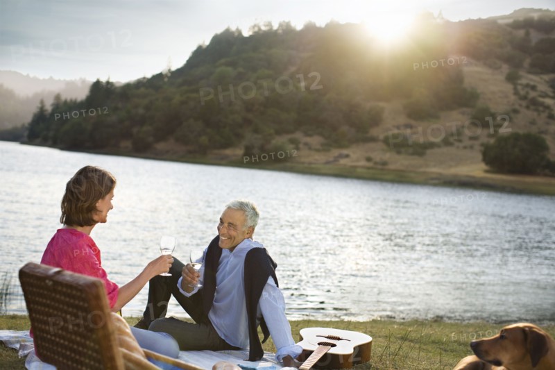 Couple enjoying wine at waterfront