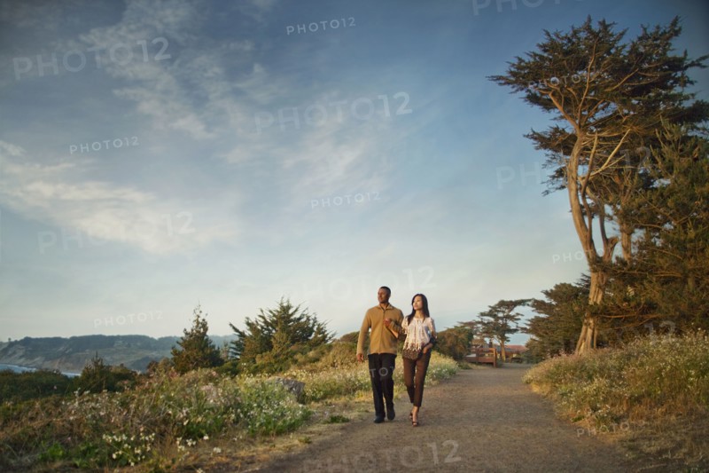 Couple walking on path in park