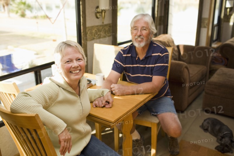 Senior Caucasian couple sitting in motor home