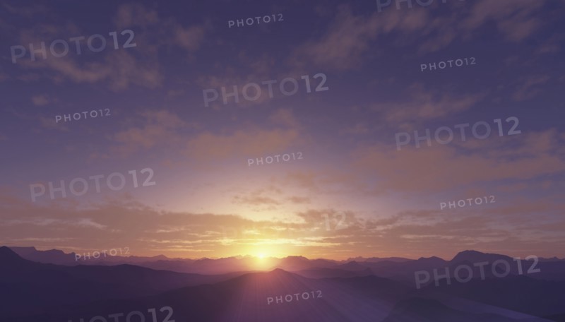 Sun setting over rural mountains