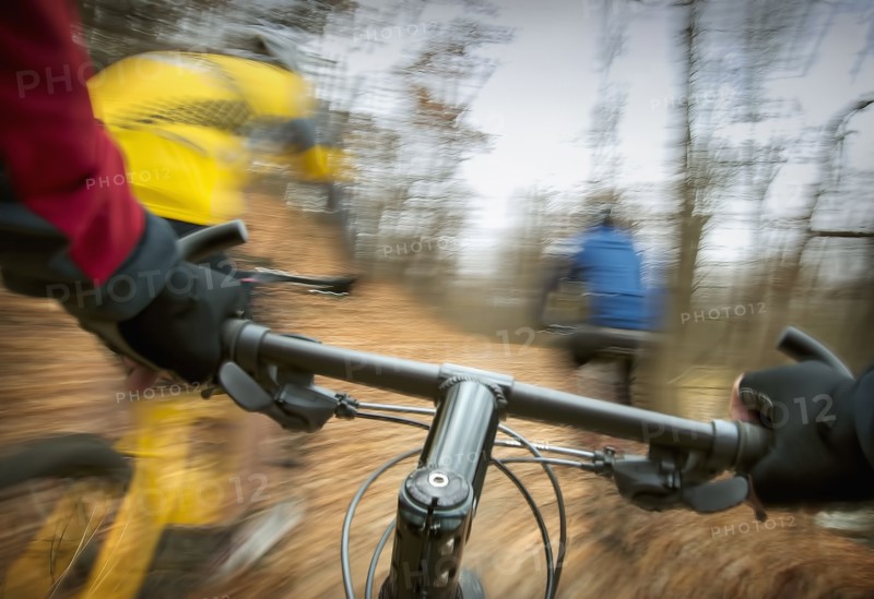 Blurred view of mountain bike in forest