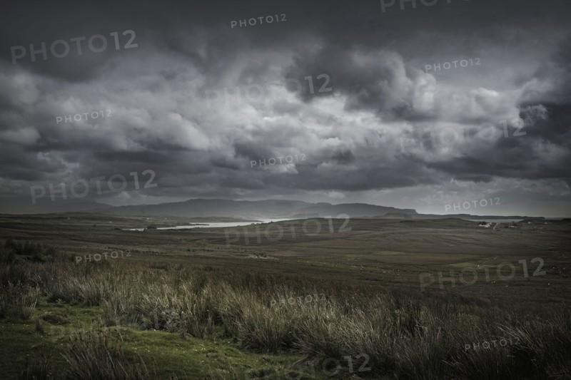 Storm clouds over rural landscape