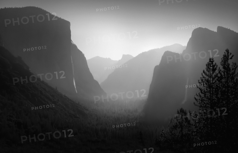 Rock formations in foggy landscape