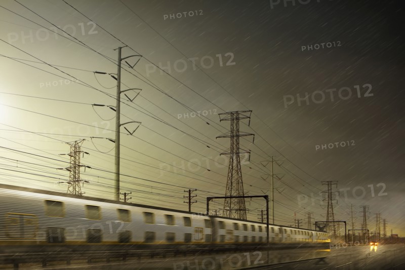 Train speeding by power lines