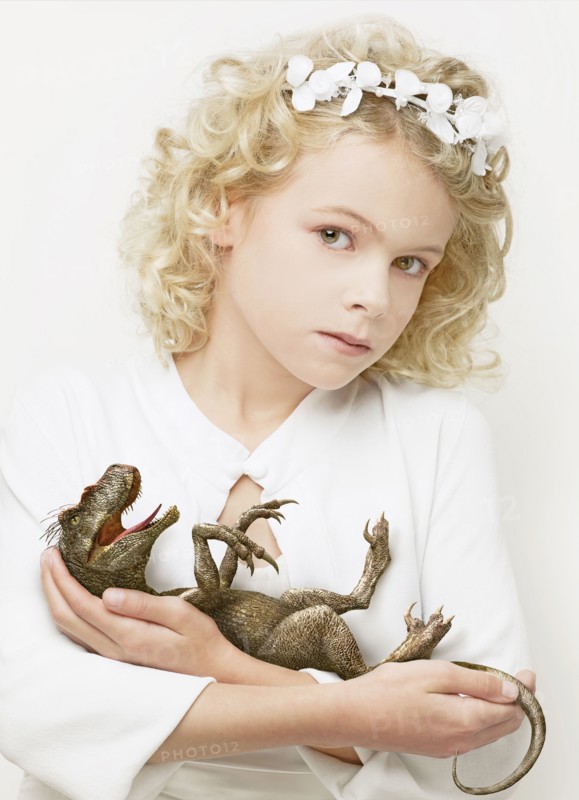 Girl cradling baby dinosaur