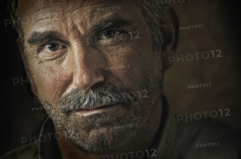 Caucasian man's grizzled face