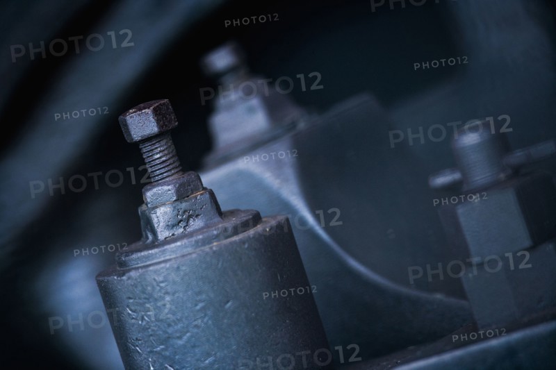 Close up of nuts and bolts on machinery