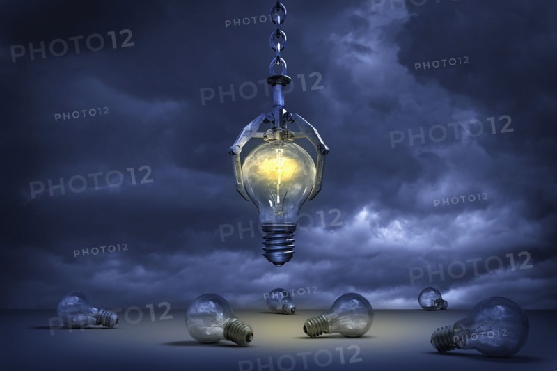 Claw grabbing illuminated light bulb