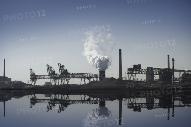Nuclear power plant reflected in still lake